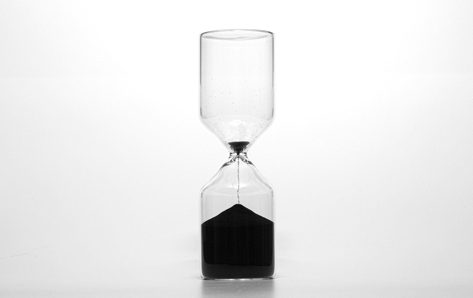 An hourglass with sand running through it. Replacement image for a lost original.