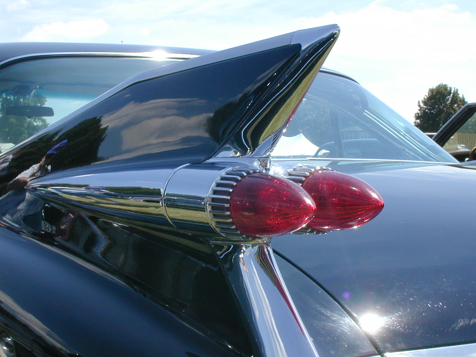 The tail fins of a 1959 Cadillac at a car show at the Gilmore Car Museum in Michigan