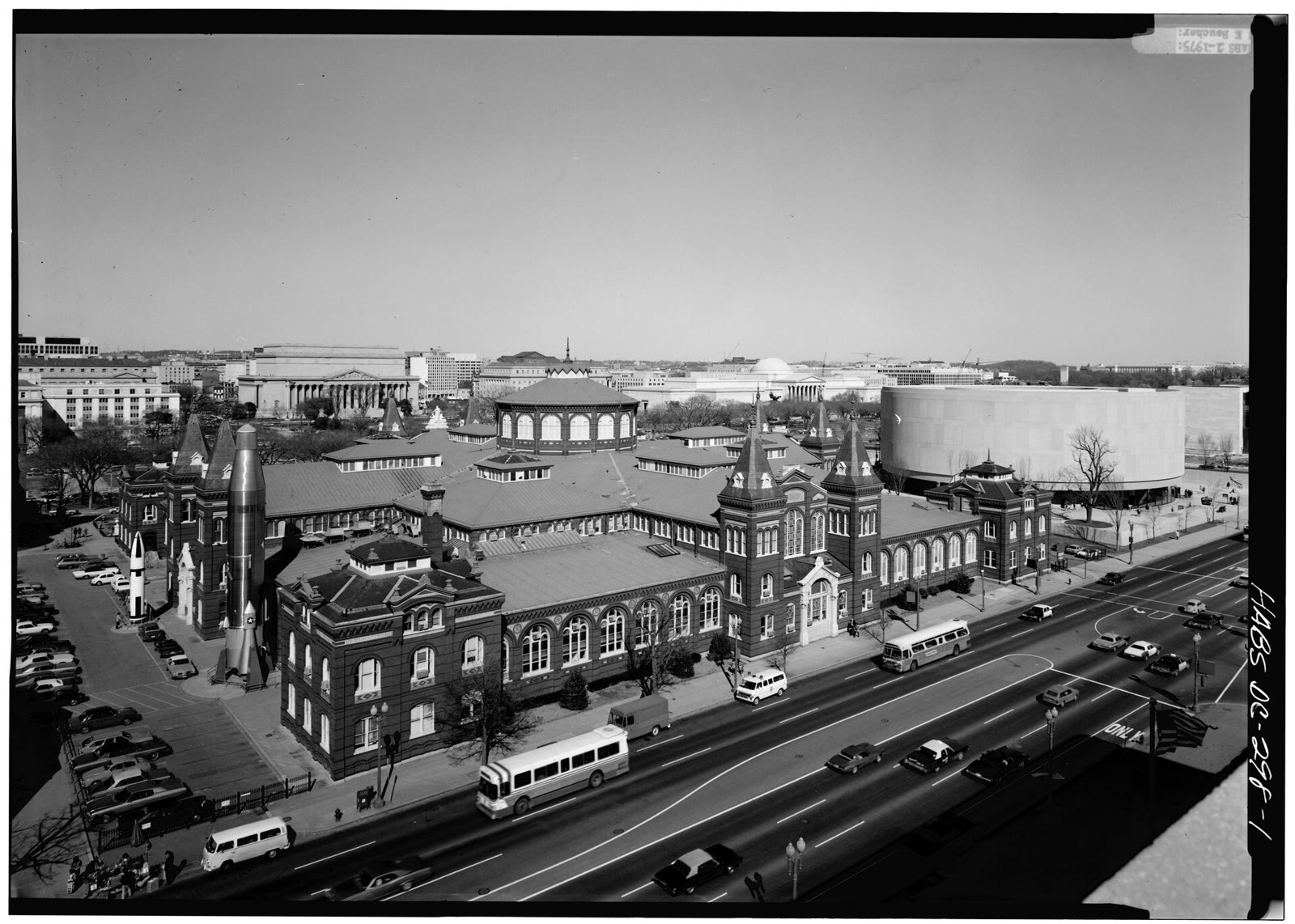 Black and white aerial view of the Arts and Industries Building and its roofs from the southwest