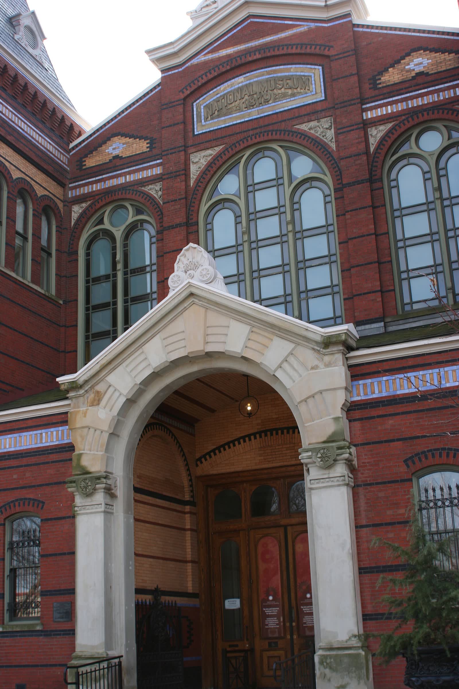 The brick and polychrome entrance of the Smithsonian's Arts and Industries Building on the National Mall