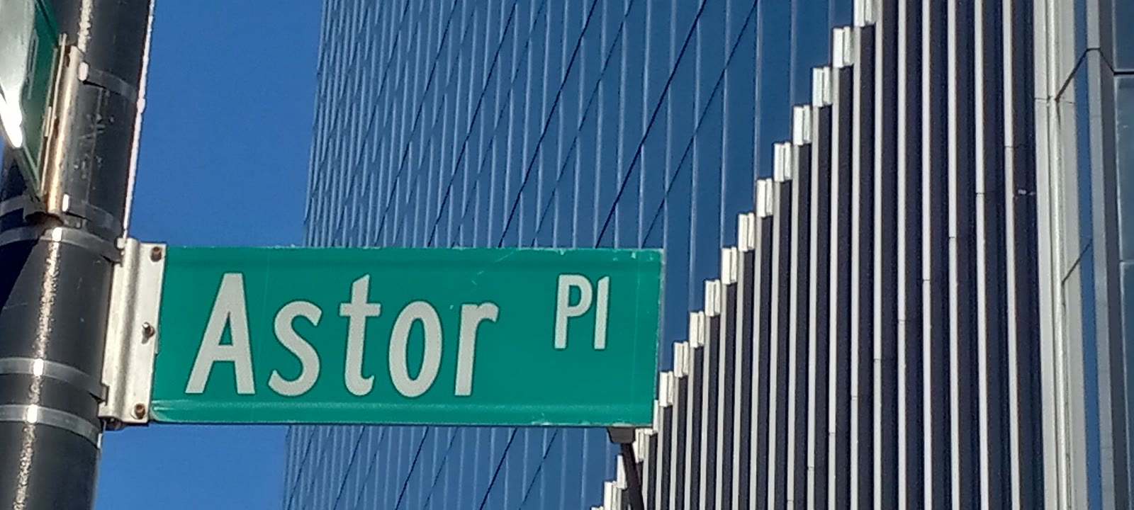 Street sign reading Astor Place in the East Village, Manhattan, photographed in January 2025