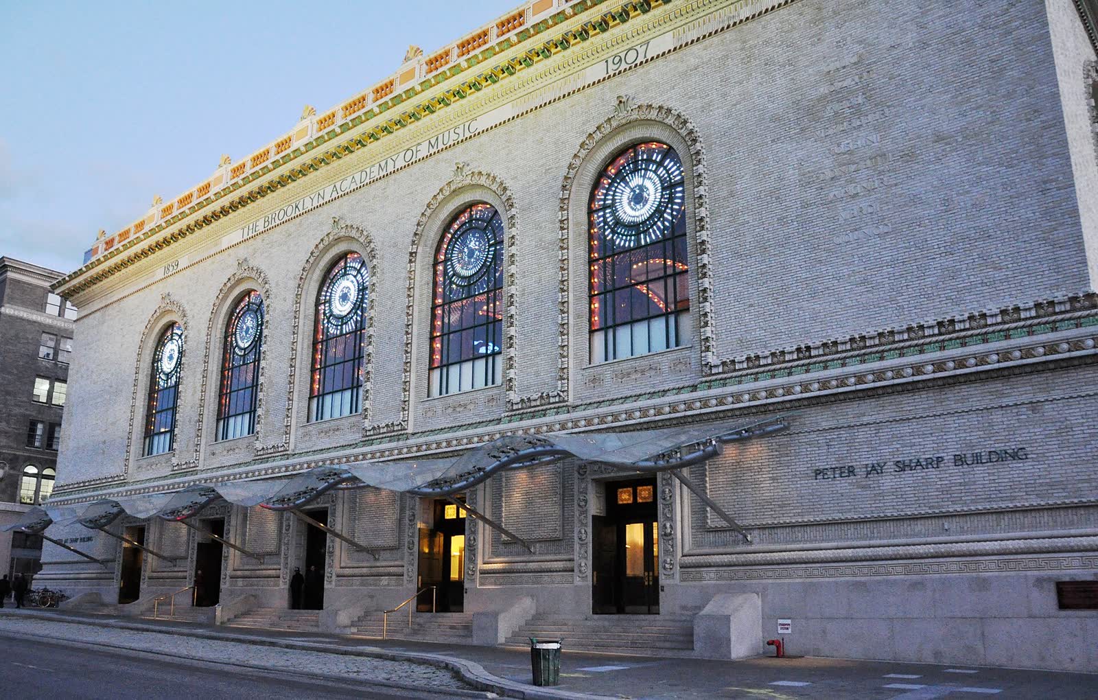 The ornate facade of the Brooklyn Academy of Music's Peter Jay Sharp Building lit by a late autumn sunset