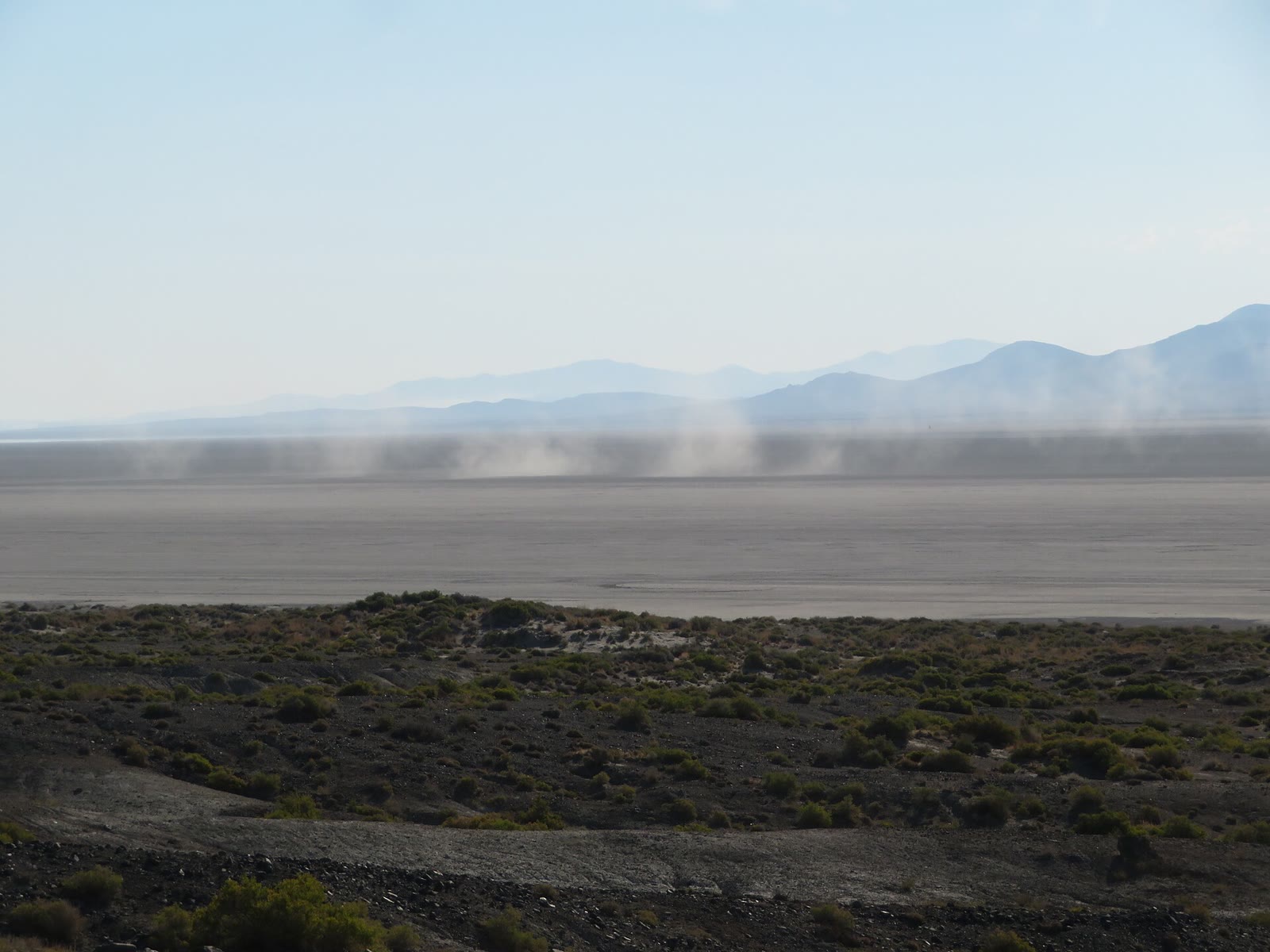 The flat, empty playa of the Black Rock Desert near Gerlach, Nevada, with mountains on the horizon