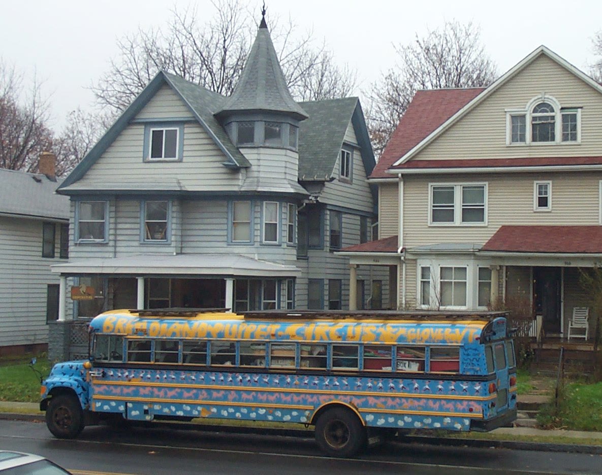 The painted Bread and Puppet tour bus parked outside the Ant Hill Cooperative in Rochester, New York