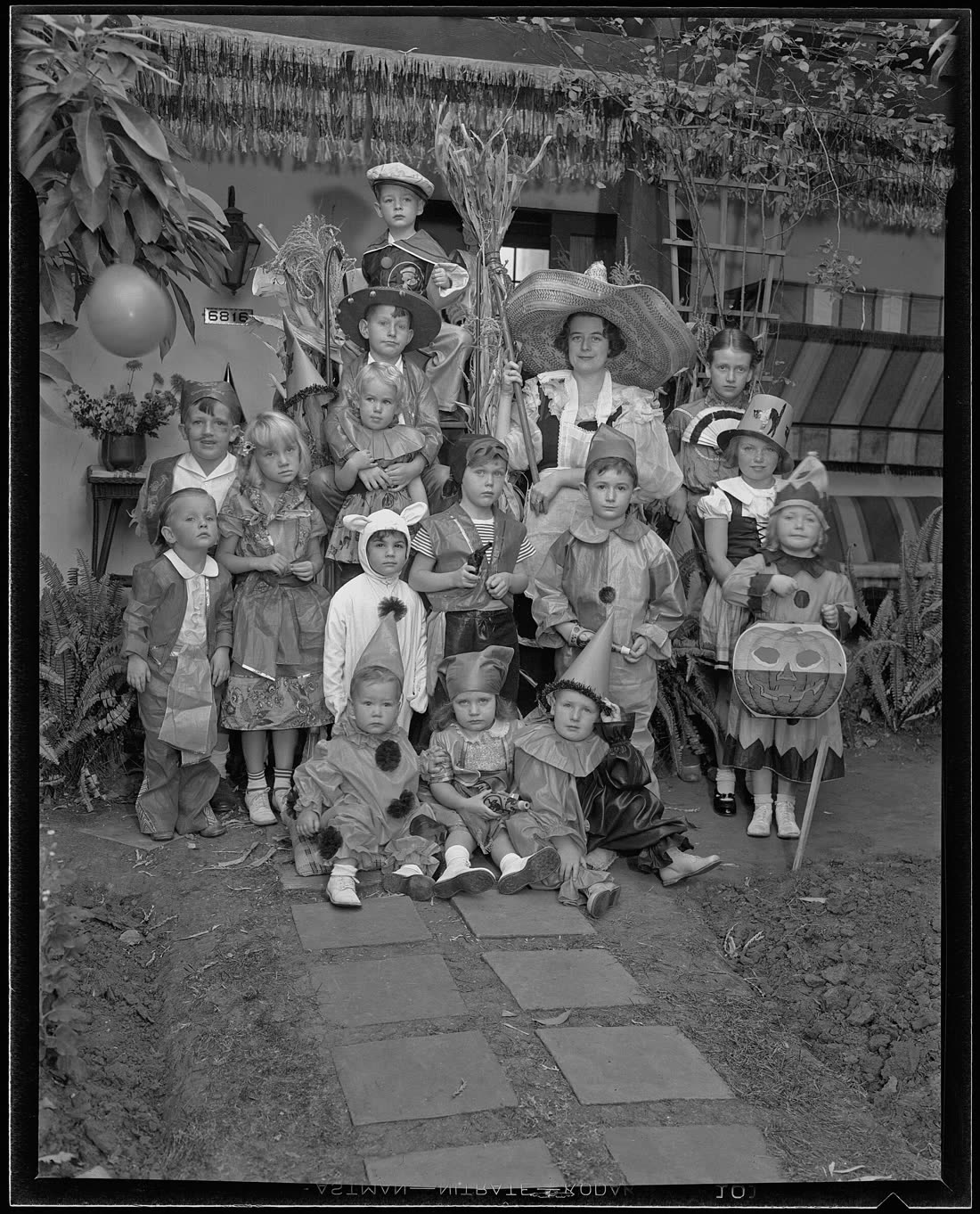 Children in Halloween costumes at a party in Los Angeles in 1935, in a black and white press photograph