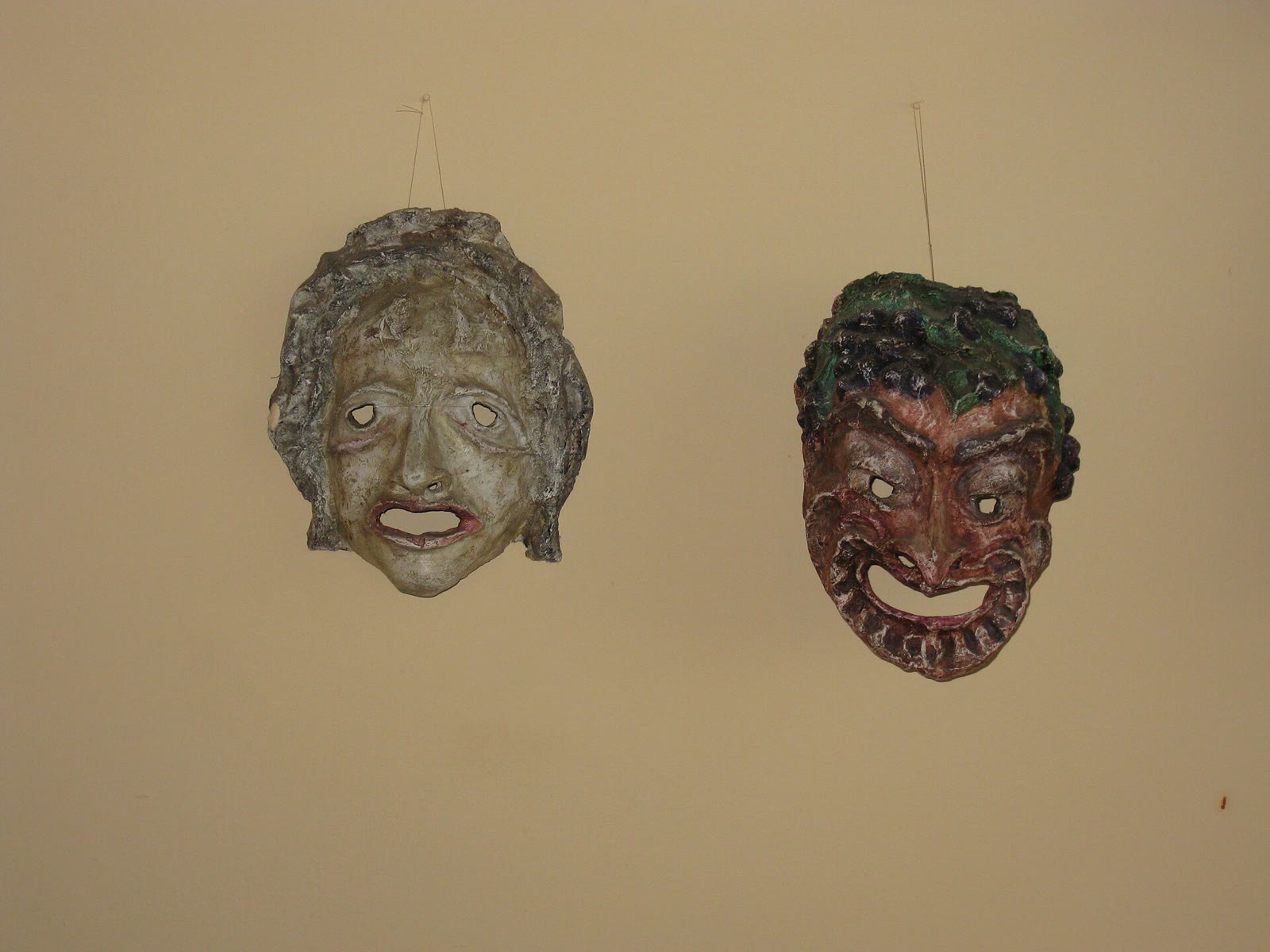 A group of Commedia dell'arte masks with exaggerated noses and brows