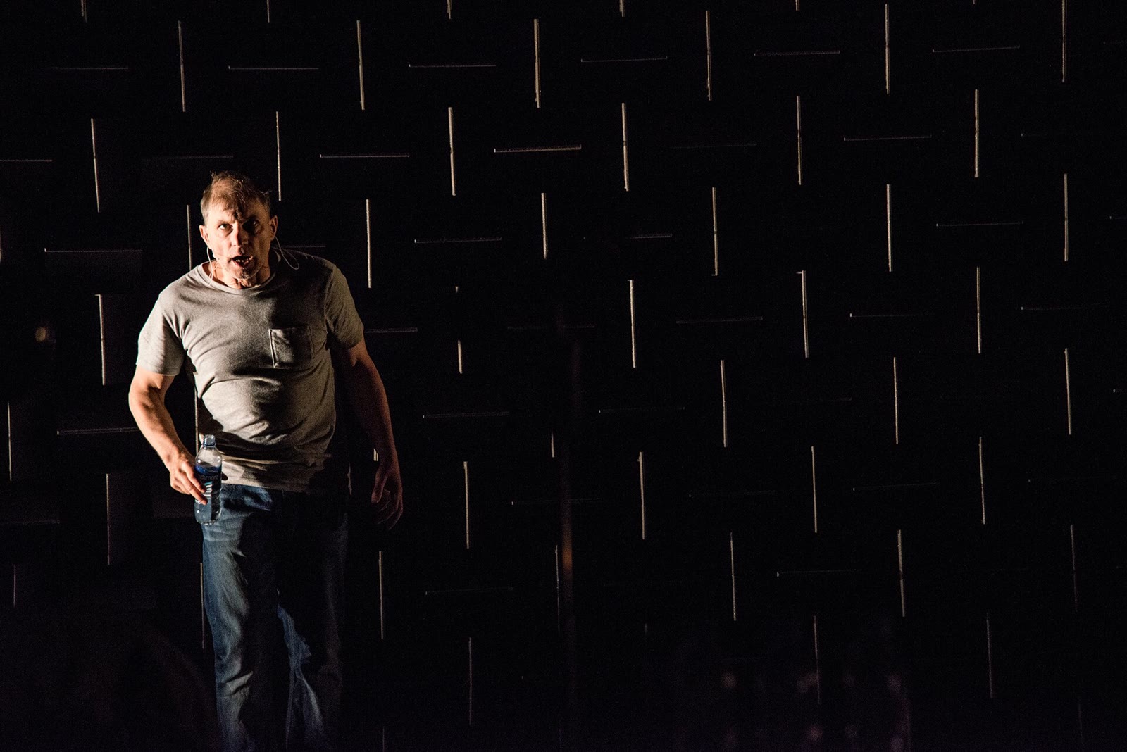 Simon McBurney performing alone on stage in Complicite's The Encounter