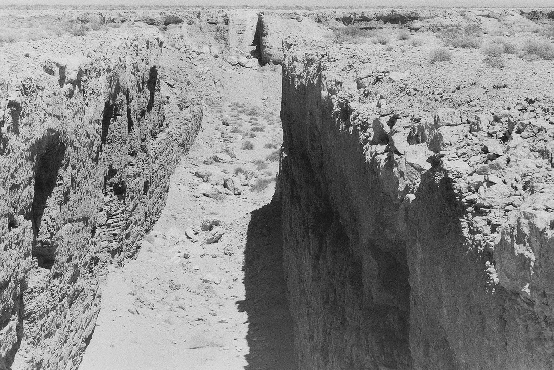 A trench of Michael Heizer's Double Negative cut into the edge of Mormon Mesa, Nevada, seen from near its rim