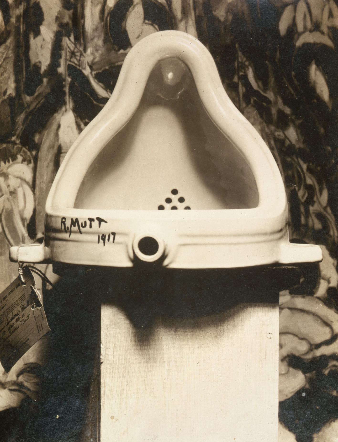 Alfred Stieglitz's photograph of Marcel Duchamp's Fountain, a porcelain urinal with an entry tag