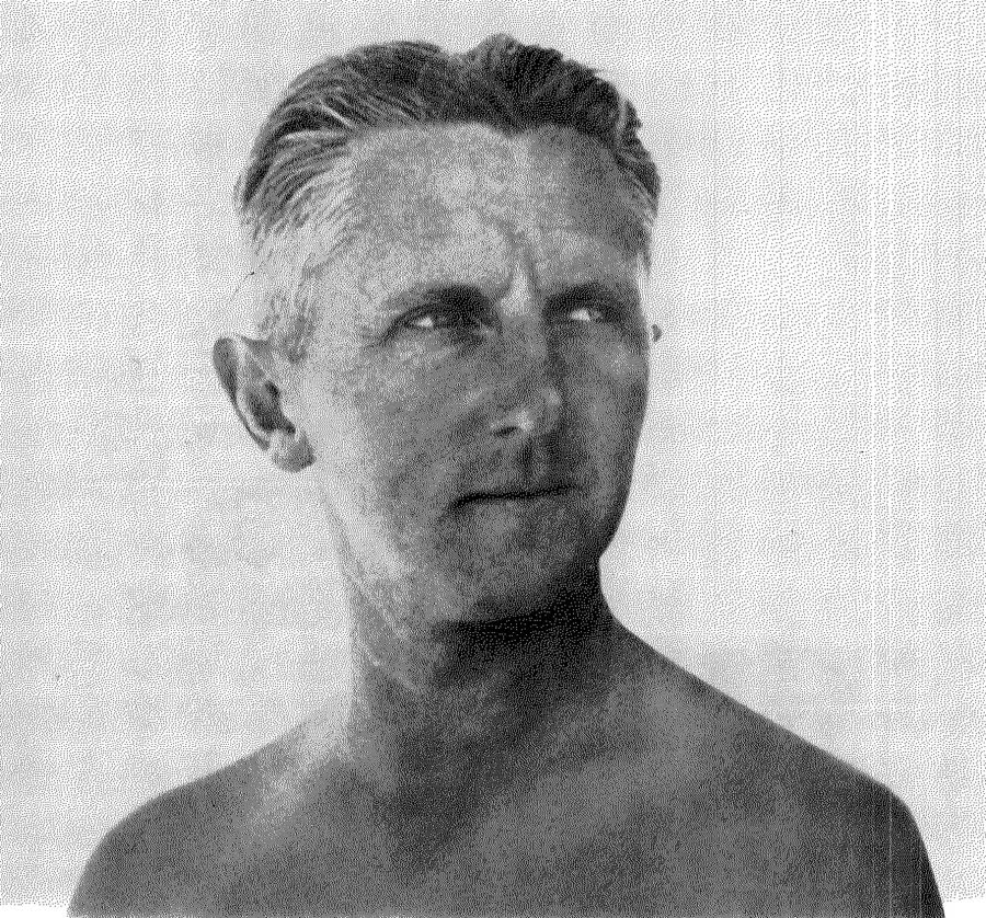 Black and white head and shoulders portrait of Erwin Piscator with swept-back hair, looking to the side