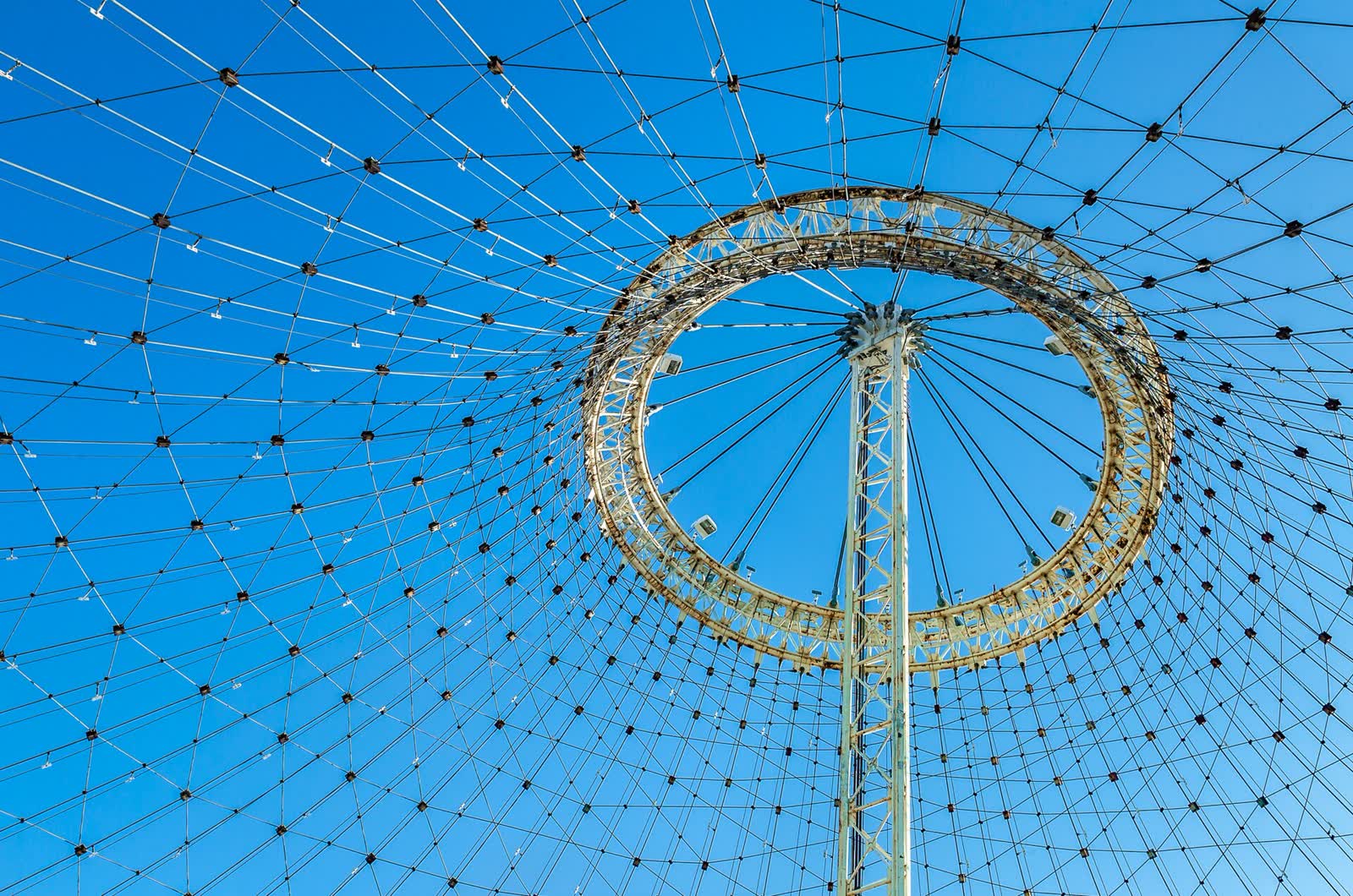 The tent-shaped steel cable framework of the Expo '74 US Pavilion beside the Spokane River
