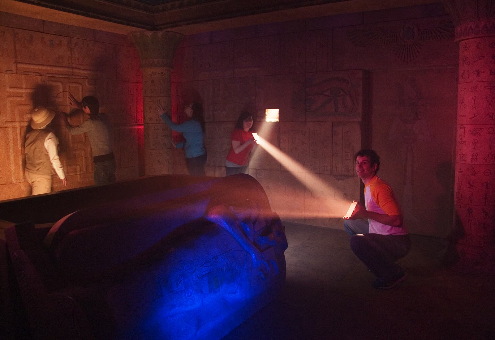 Players solving a light puzzle in Tomb, the original 5 Wits walk-through adventure in Boston