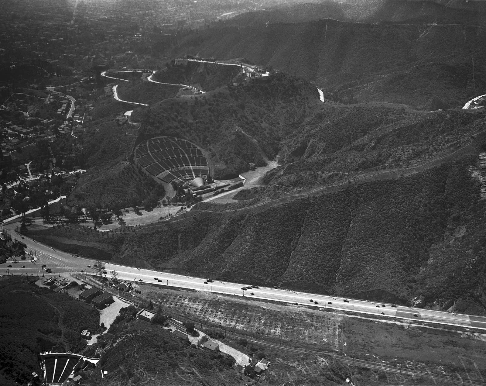 Early 1930s aerial view of the Cahuenga Pass amphitheatre now called the Ford, lower left, with the Hollywood Bowl beyond