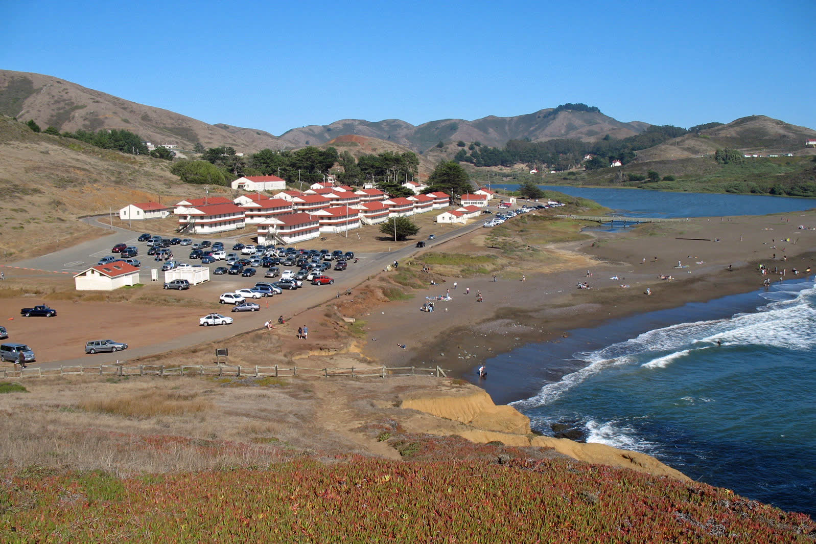 Fort Cronkhite buildings and Rodeo Beach in the Marin Headlands seen from a hillside trail