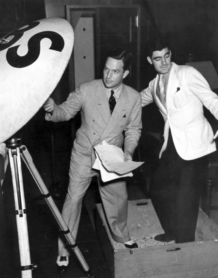 Black and white CBS publicity photo from the radio program Gang Busters showing how some of its sound effects were created, September 1937