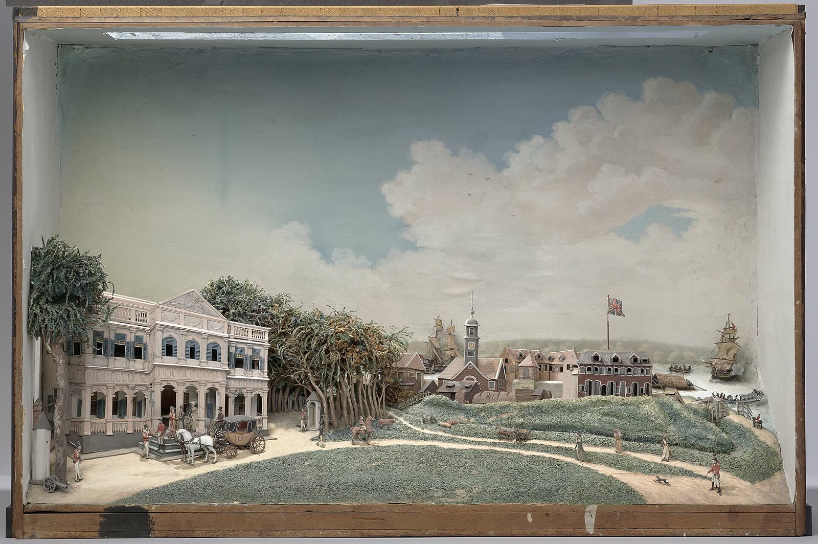 A small diorama with figures and buildings showing the Government Square in Paramaribo, made in 1812