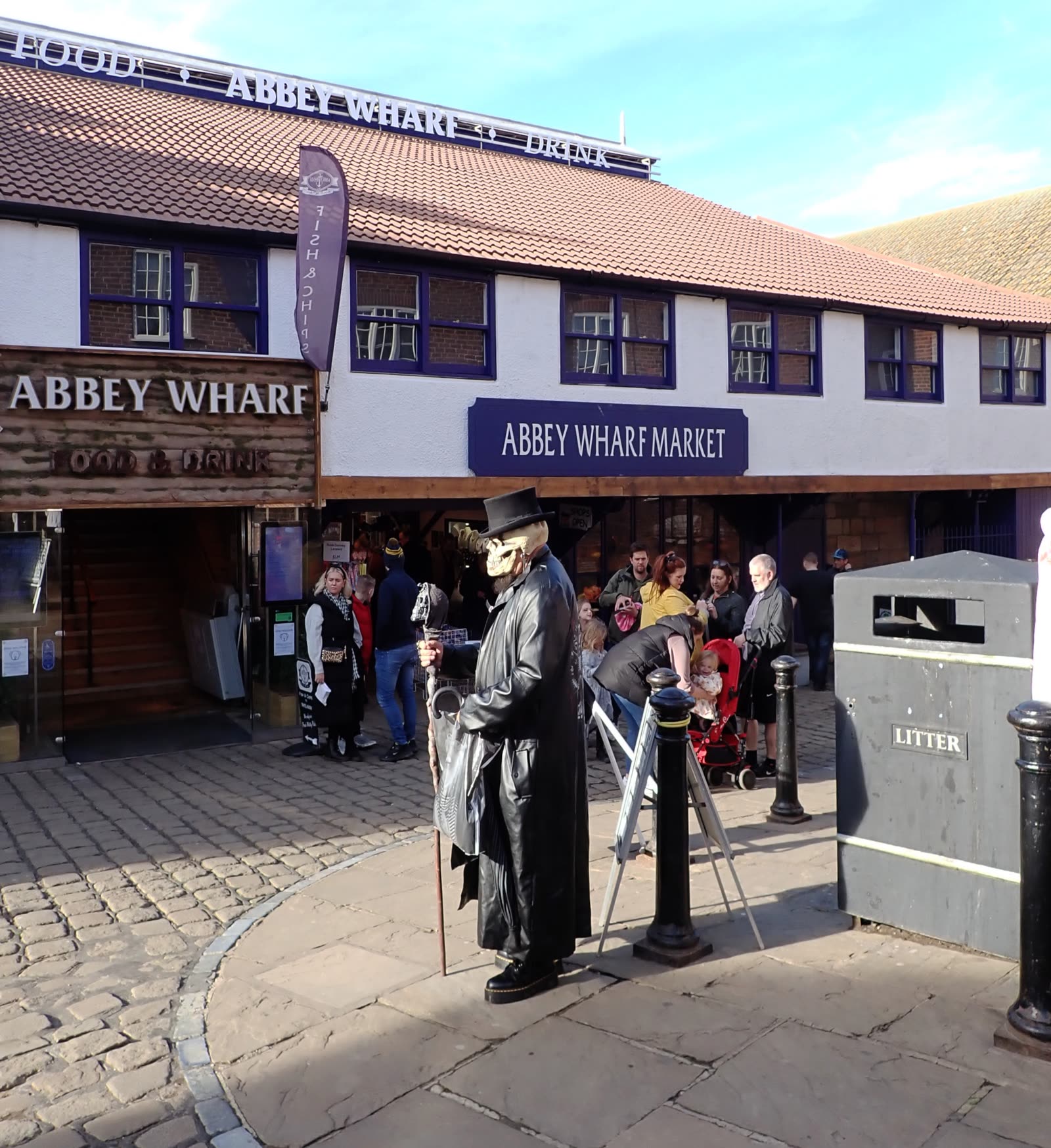 A ghost tour guide on Sandgate, a narrow street in Whitby