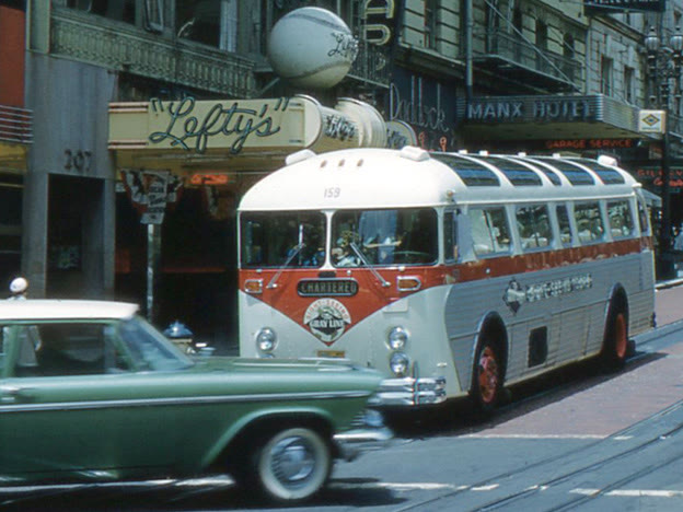 A Gray Line sightseeing bus and two cable cars on Powell Street, San Francisco, in July 1959