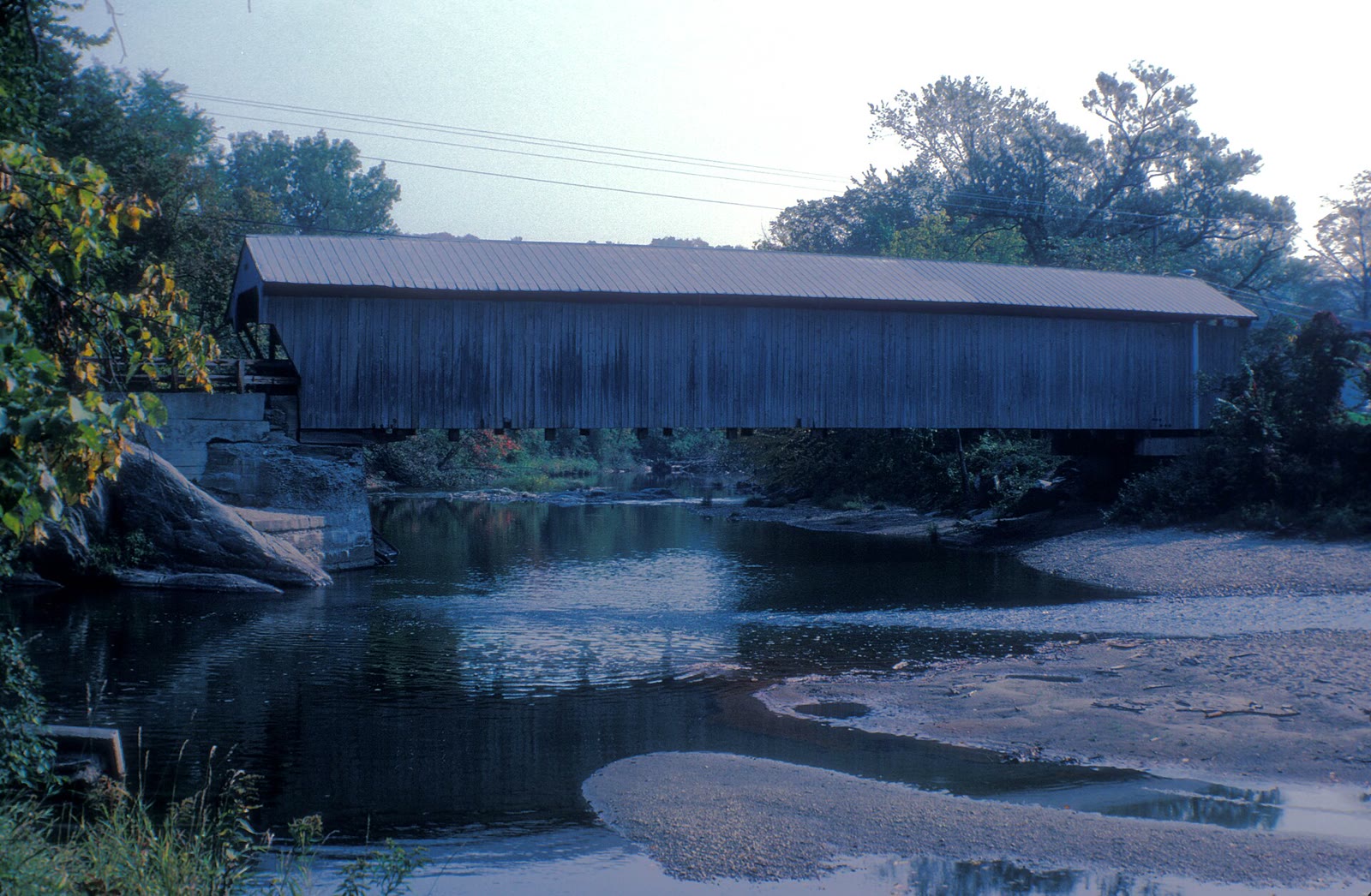 The wooden Great Eddy covered bridge over the Mad River in Waitsfield, Vermont, in 1970