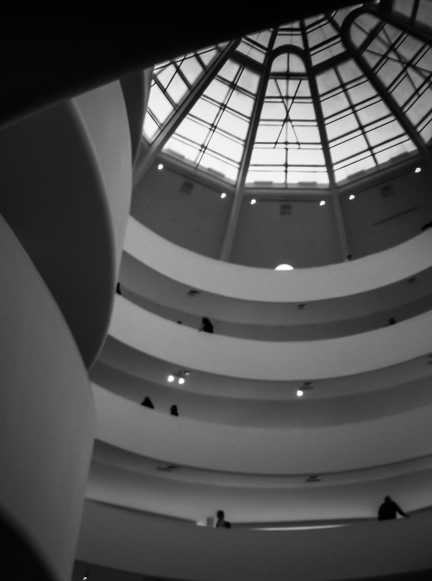 Black and white view of the curving spiral of the Guggenheim Museum in New York