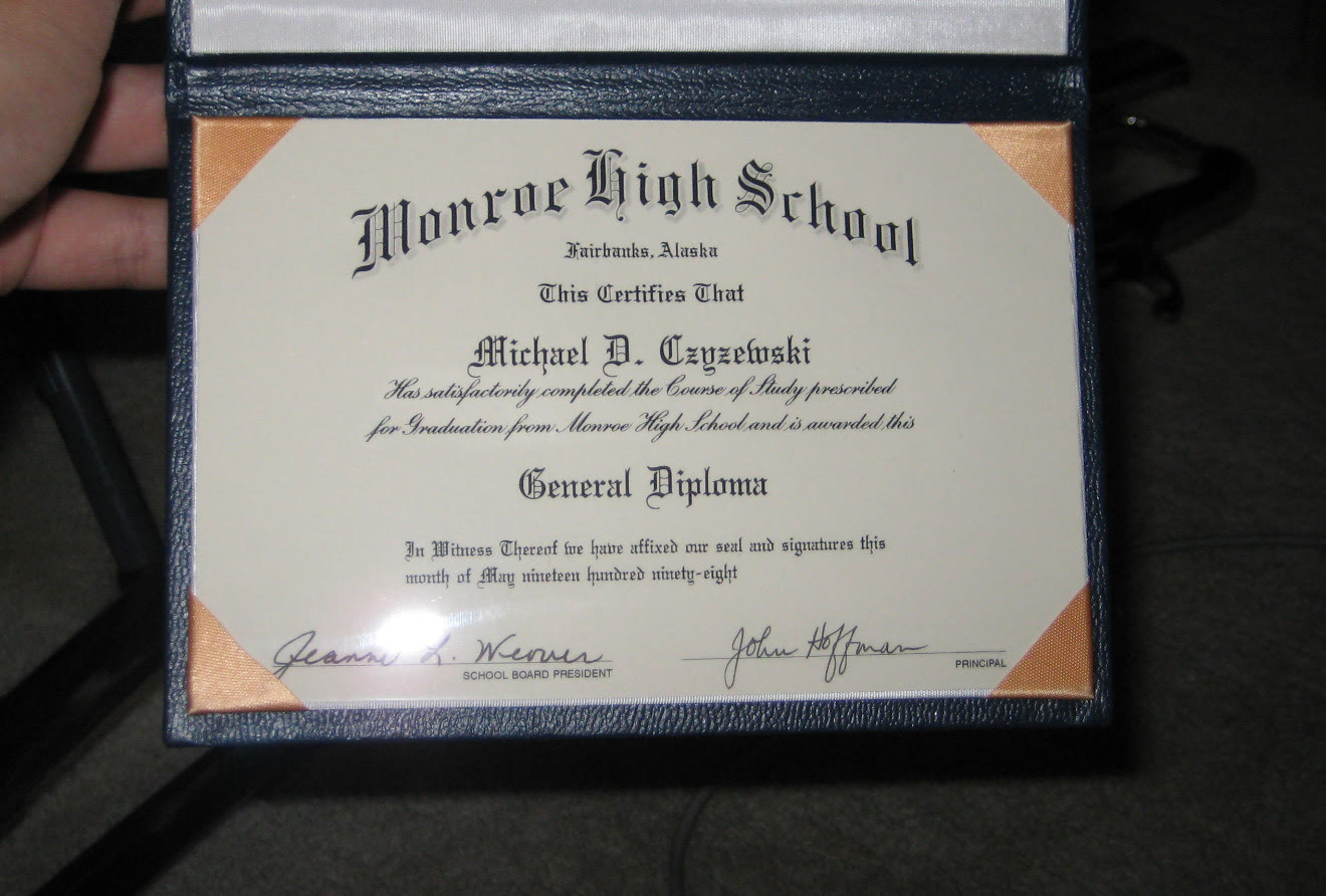 A printed high school diploma certificate with a school seal and signatures
