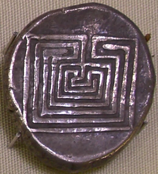 Ancient silver coin from Knossos stamped with a labyrinth design, about 400 BCE, in the Heraklion Archaeological Museum