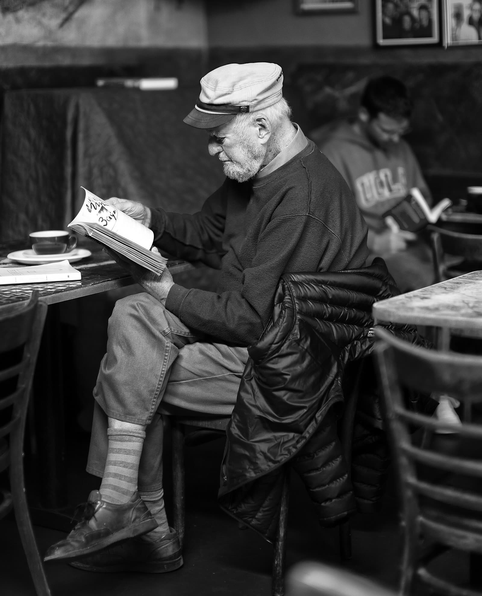 Black and white portrait of the poet and publisher Lawrence Ferlinghetti at Caffe Trieste in 2012
