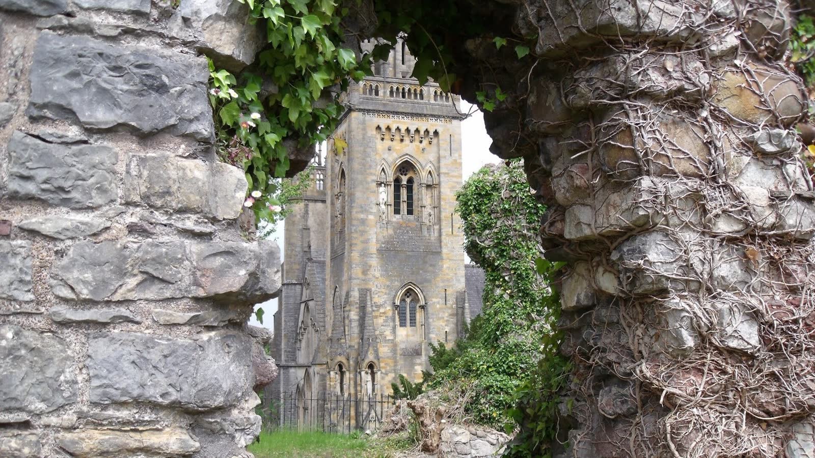 Llandaff Cathedral in Cardiff, a medieval church with a tall west tower and spire