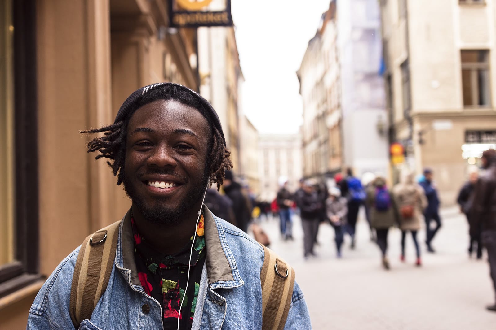 Man wearing headphones outdoors in Stockholm