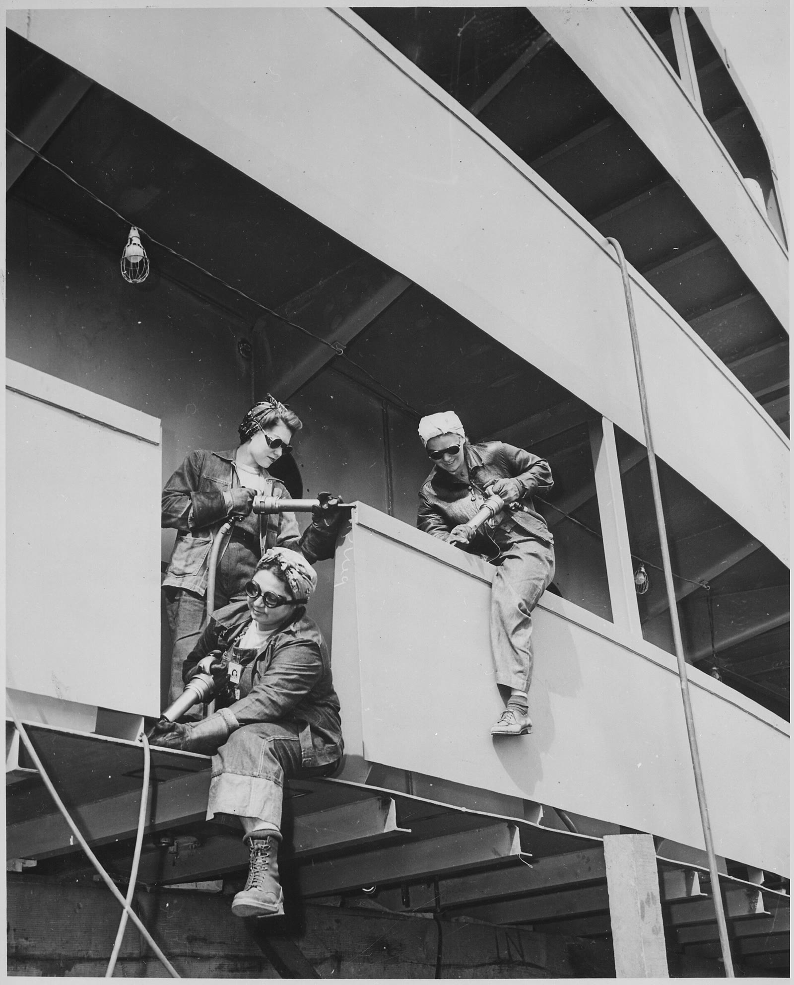 Black and white 1942 photograph of women war workers known as chippers at the Marinship shipyard