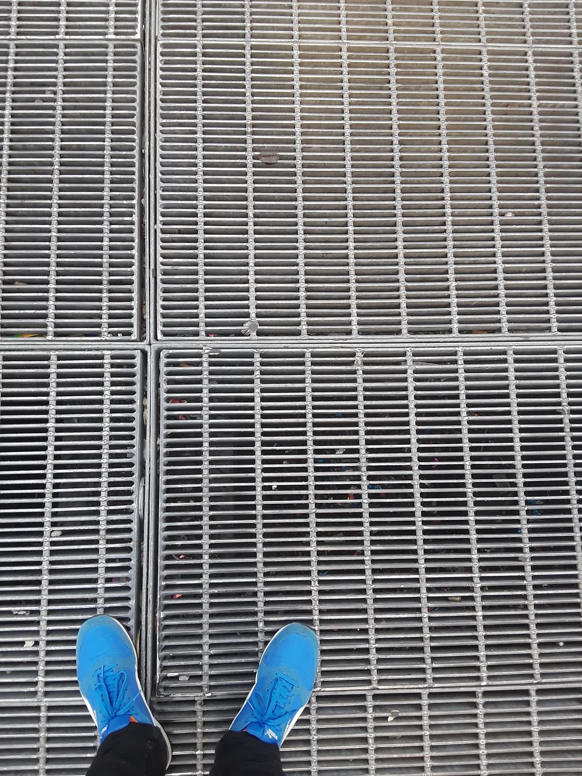 Metal subway grate in Times Square from which a Max Neuhaus sound work emanates
