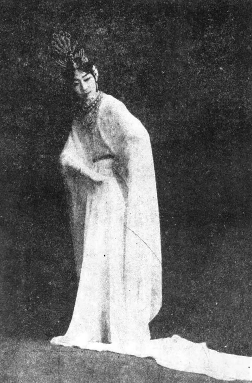Mei Lanfang in the long white robes and headdress of the role of Yang Guifei, standing in a stage pose