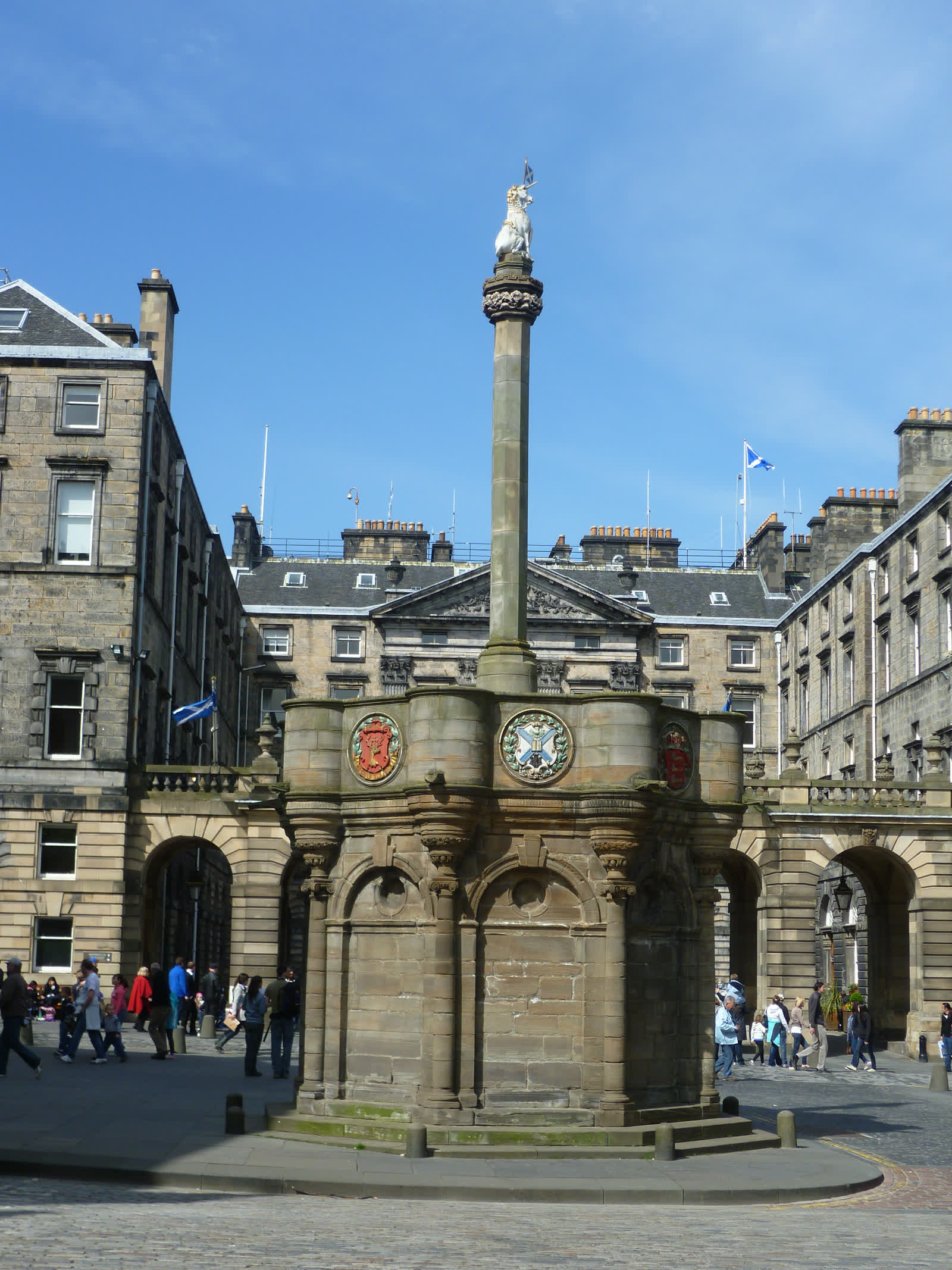 The Mercat Cross, a carved stone column topped by a unicorn, on Edinburgh's Royal Mile