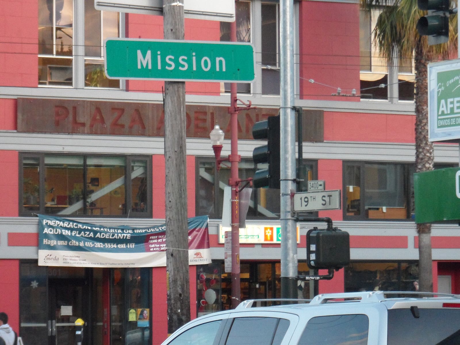 Street signs at the corner of Mission Street and 19th Street in San Francisco
