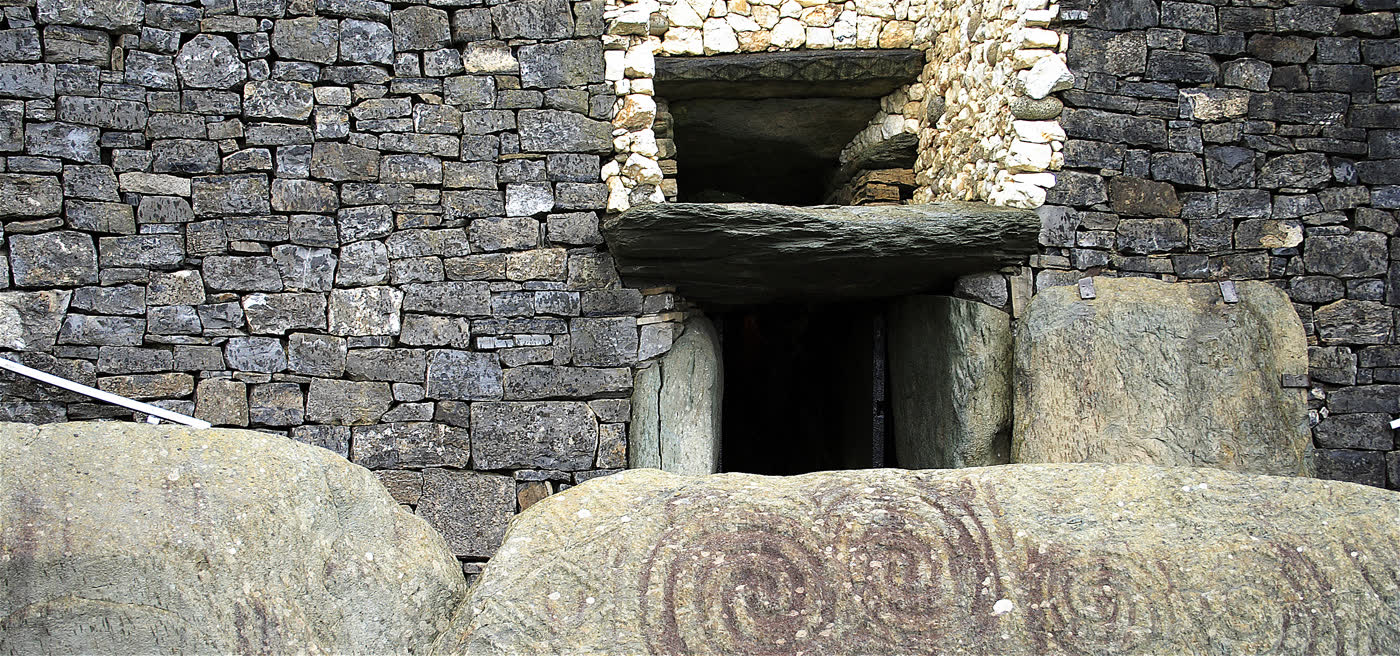 Entrance to the Newgrange passage tomb in Ireland, with the roof box that admits solstice sunlight