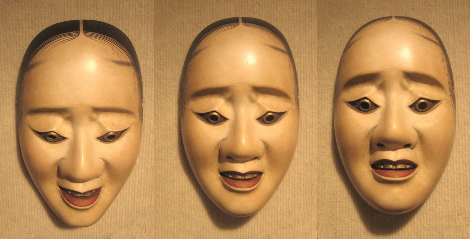 Three photographs of the same Noh hawk mask tilted at different angles, showing how its expression changes