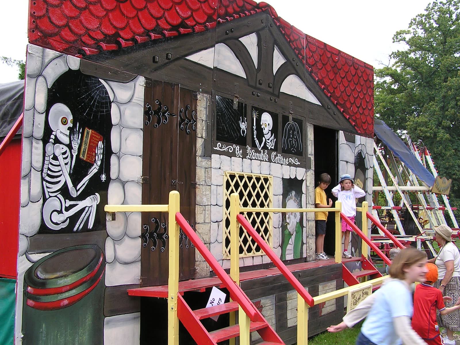 Painted fairground facade of the Orton and Spooner haunted house preserved at Hollycombe, Liphook, England