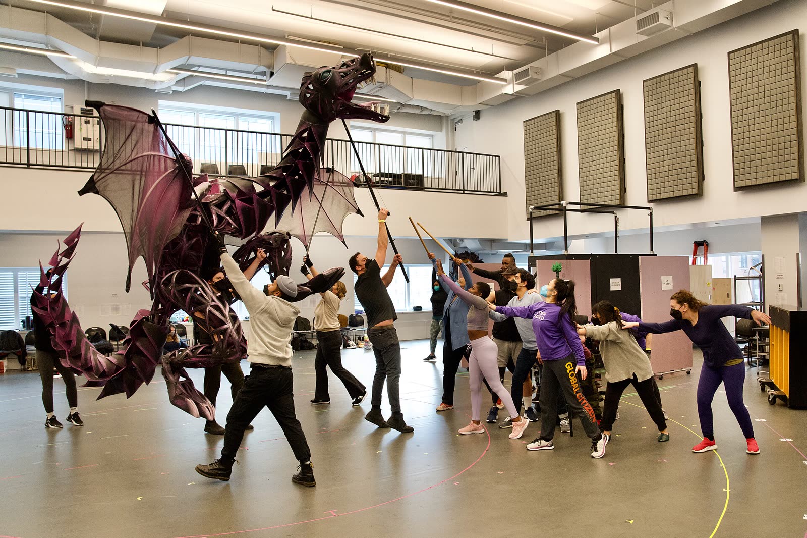Cast members working through a scene in a rehearsal for the musical Other World