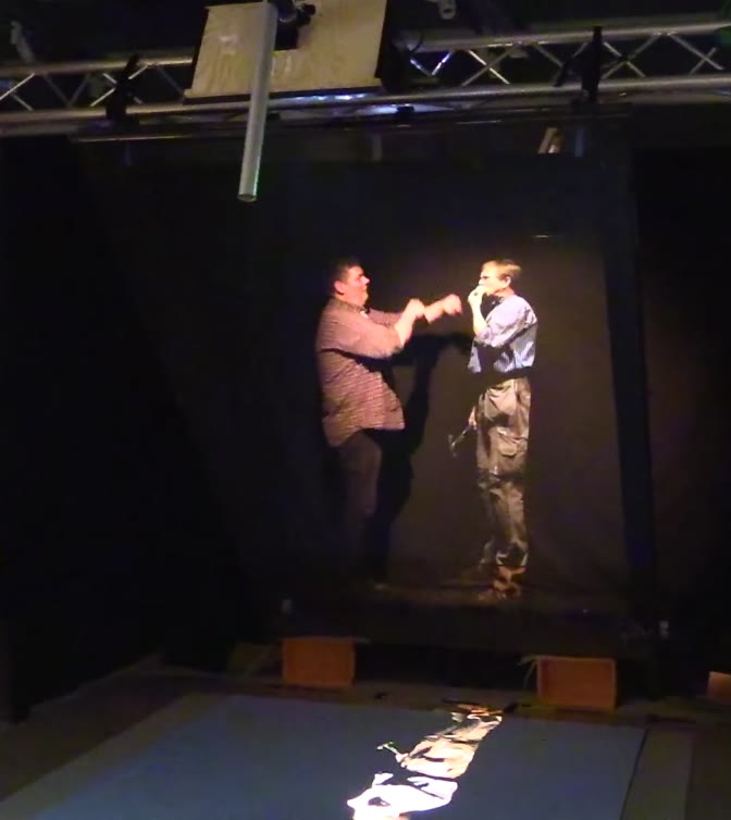 Pepper's ghost test rig with a video screen reflected in angled glass, built at a Swedish Exhibition Agency workshop in 2015
