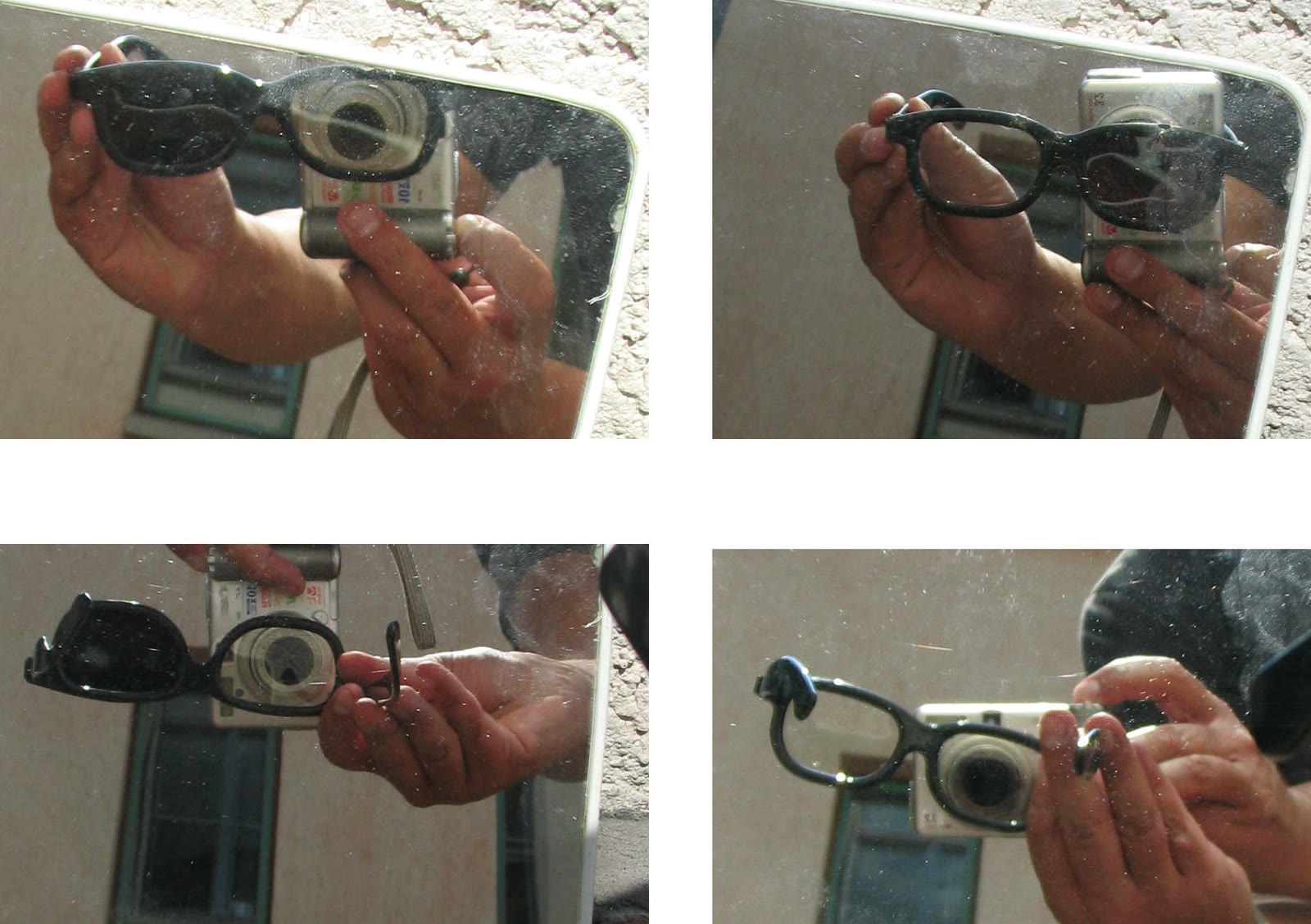 Polarized 3-D glasses held up to a mirror, some lenses showing dark where the polarization blocks light