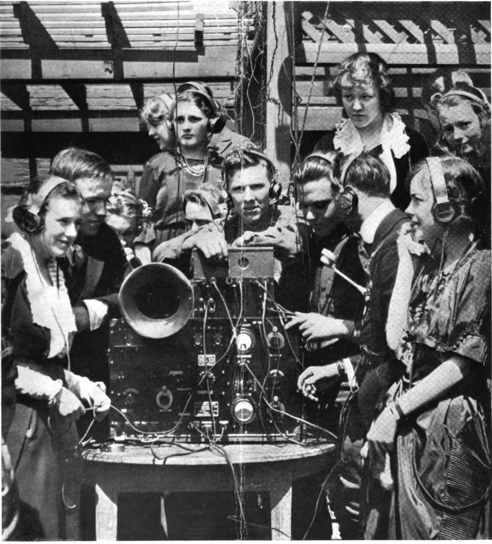 Couples dancing while wearing earphones at a 1920 radiophone dance held by an Atlanta club