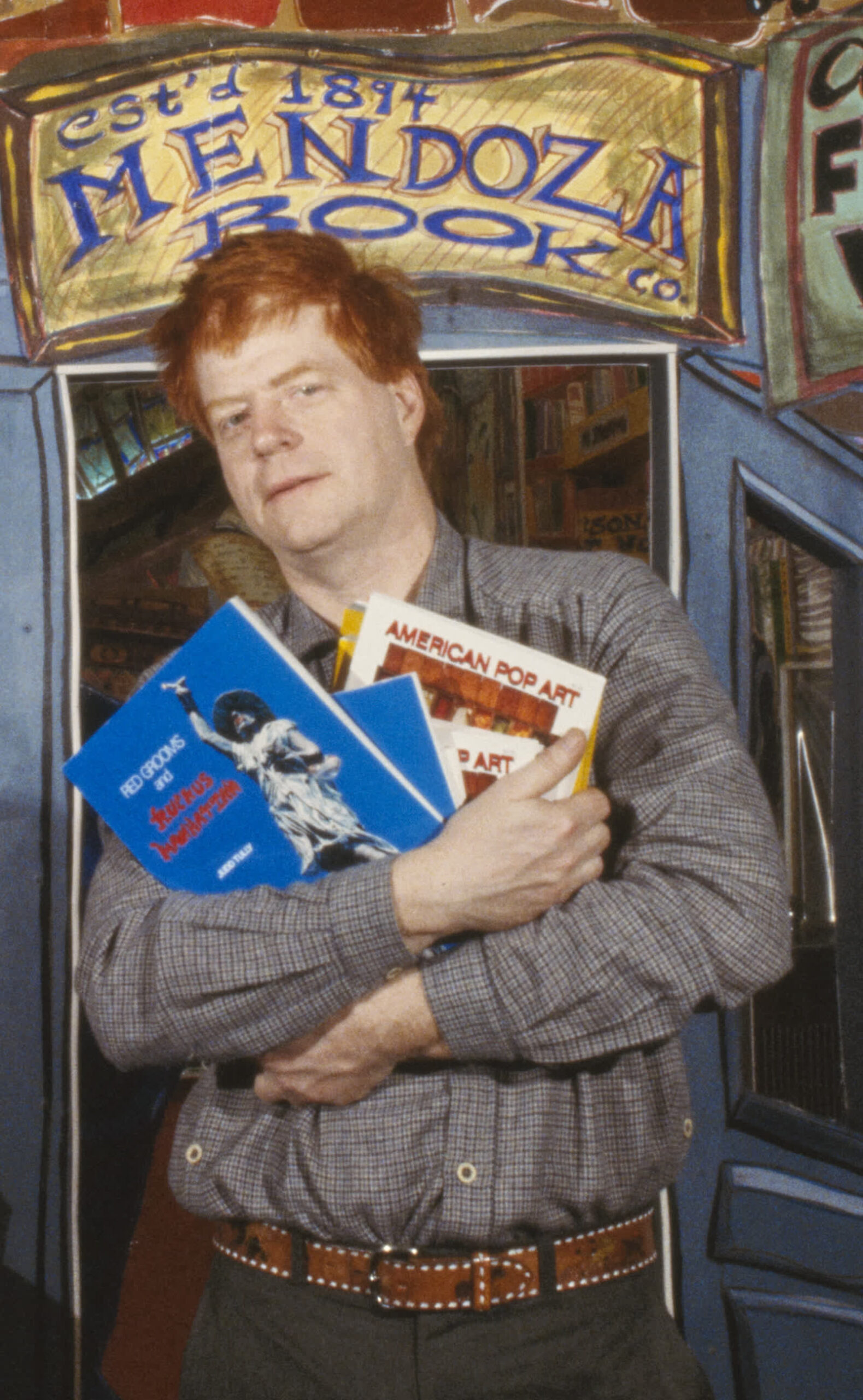 The artist Red Grooms standing with his work Bookstore in 1978