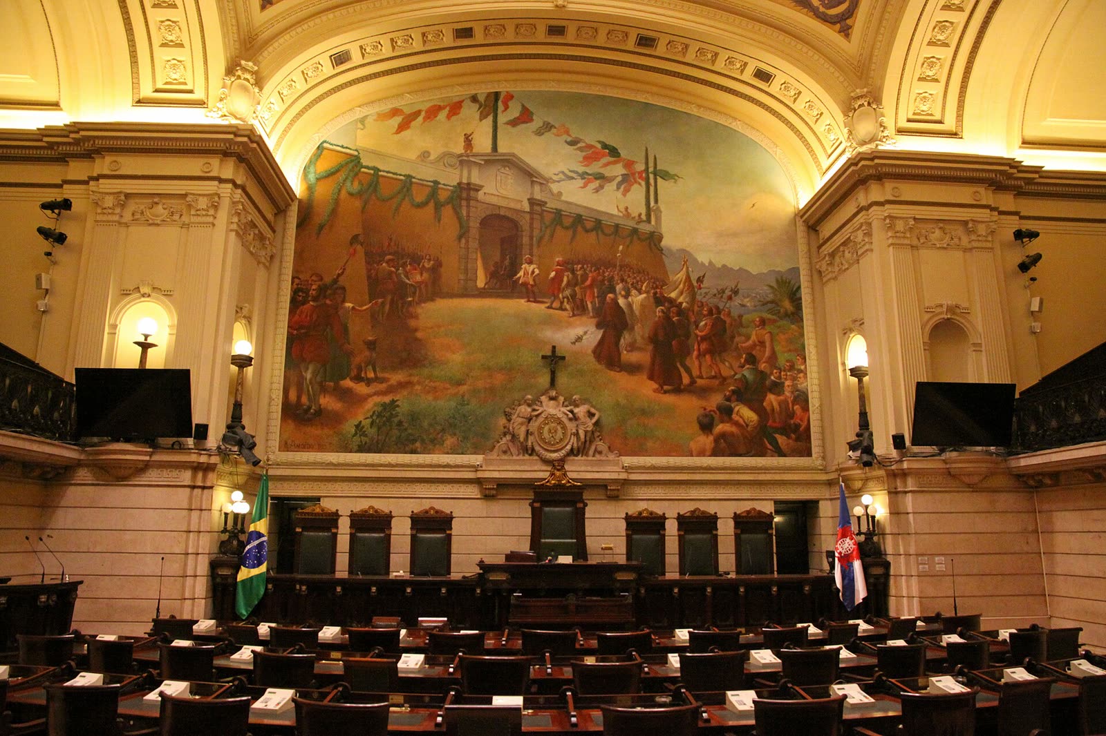 The plenary chamber of Rio de Janeiro's city council in the Palácio Pedro Ernesto, with a large painted panel behind the presiding table