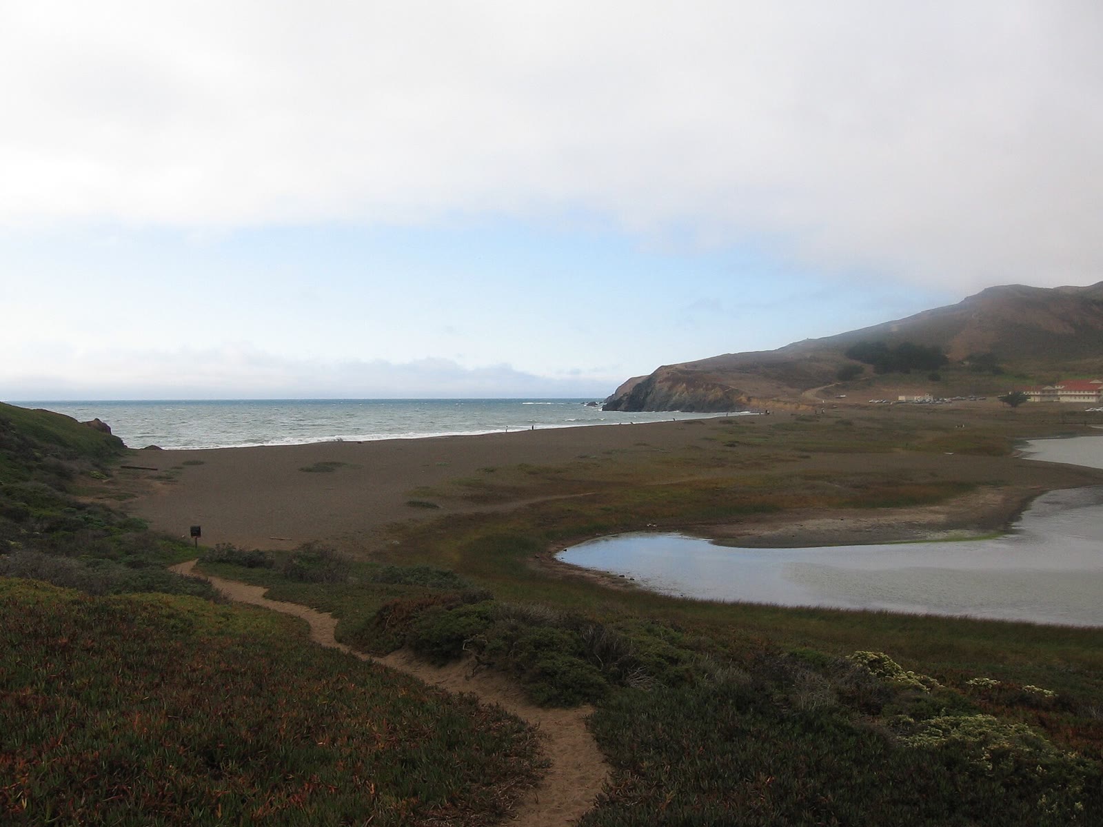 Rodeo Beach in Marin County with Pacific surf and the headland hills behind it