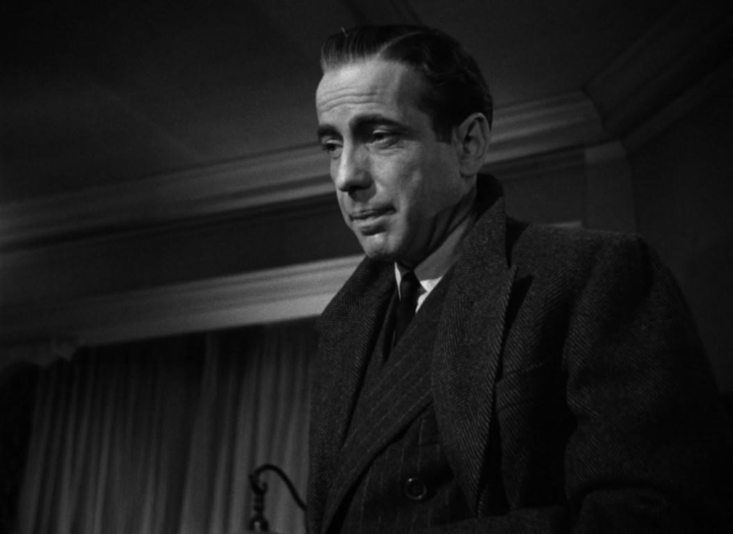 Humphrey Bogart as the detective Sam Spade in a black and white frame from the 1941 Maltese Falcon trailer