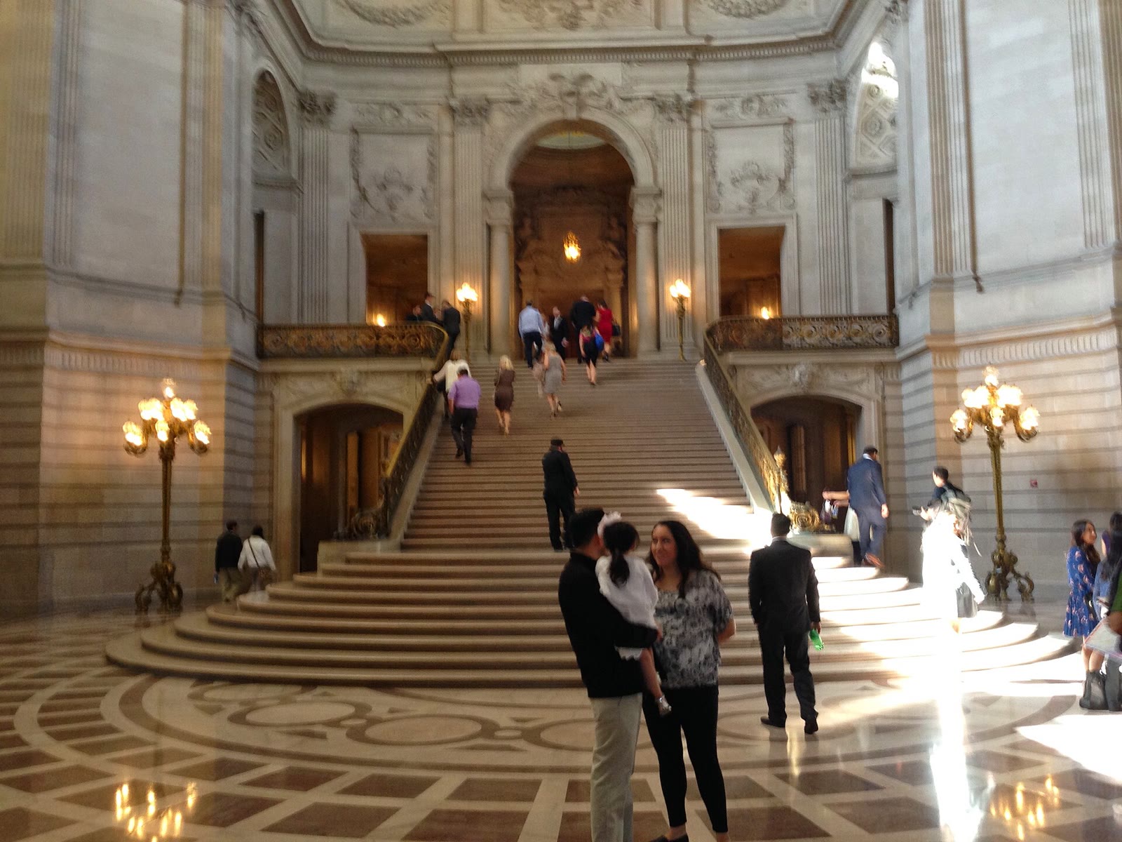 Visitors in the marble rotunda of San Francisco City Hall