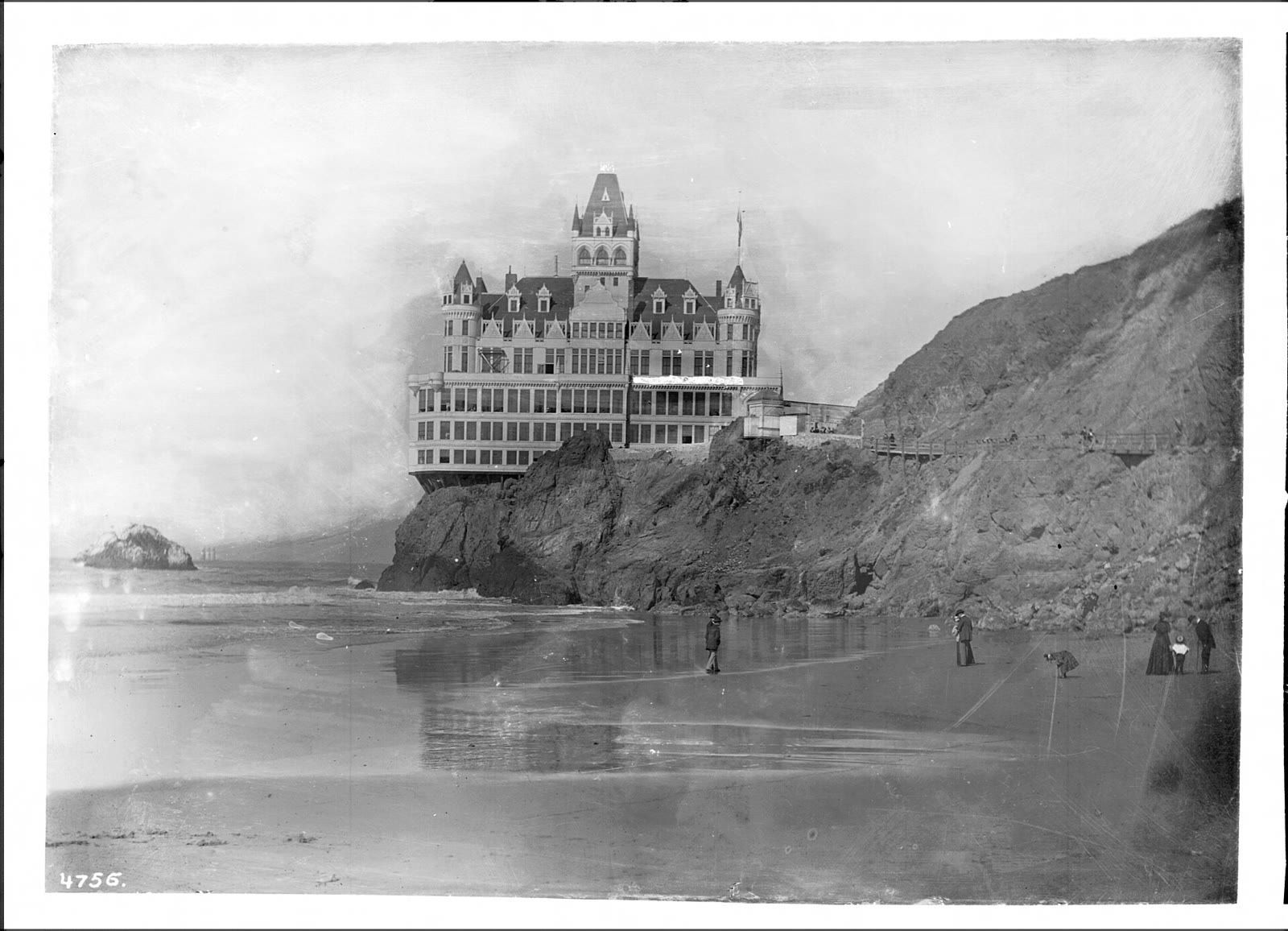 Photograph of the many-towered Cliff House above Seal Rocks, about 1900