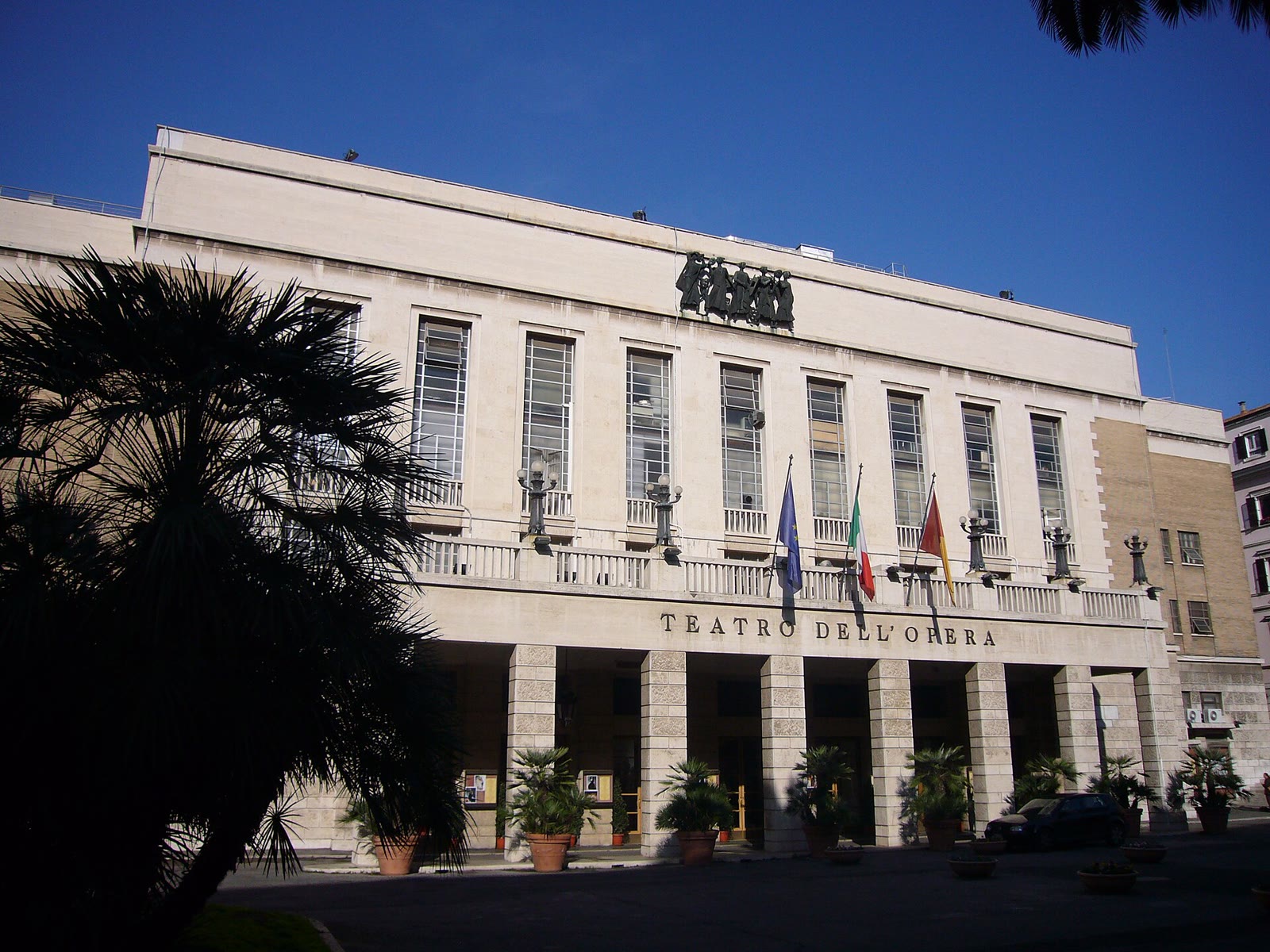 The pale stone facade of the Teatro dell'Opera di Roma, the former Teatro Costanzi