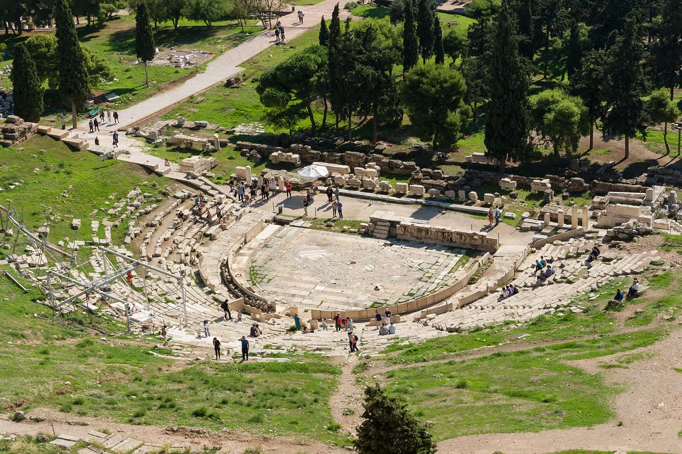 Ancient Theatre of Dionysus in Athens, rows of fixed stone seating facing the old stage area