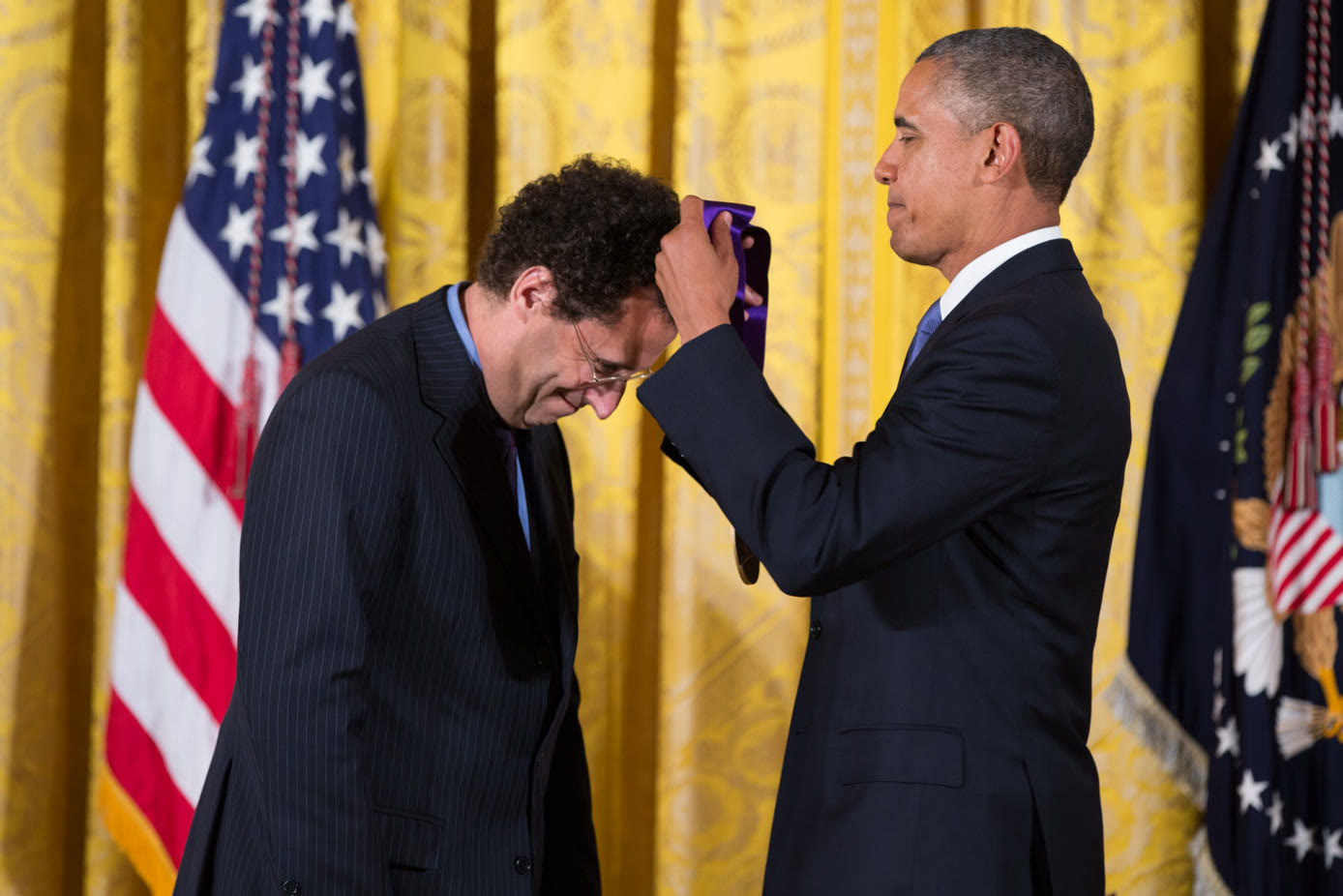 Playwright Tony Kushner receiving the National Medal of Arts from President Barack Obama at the White House